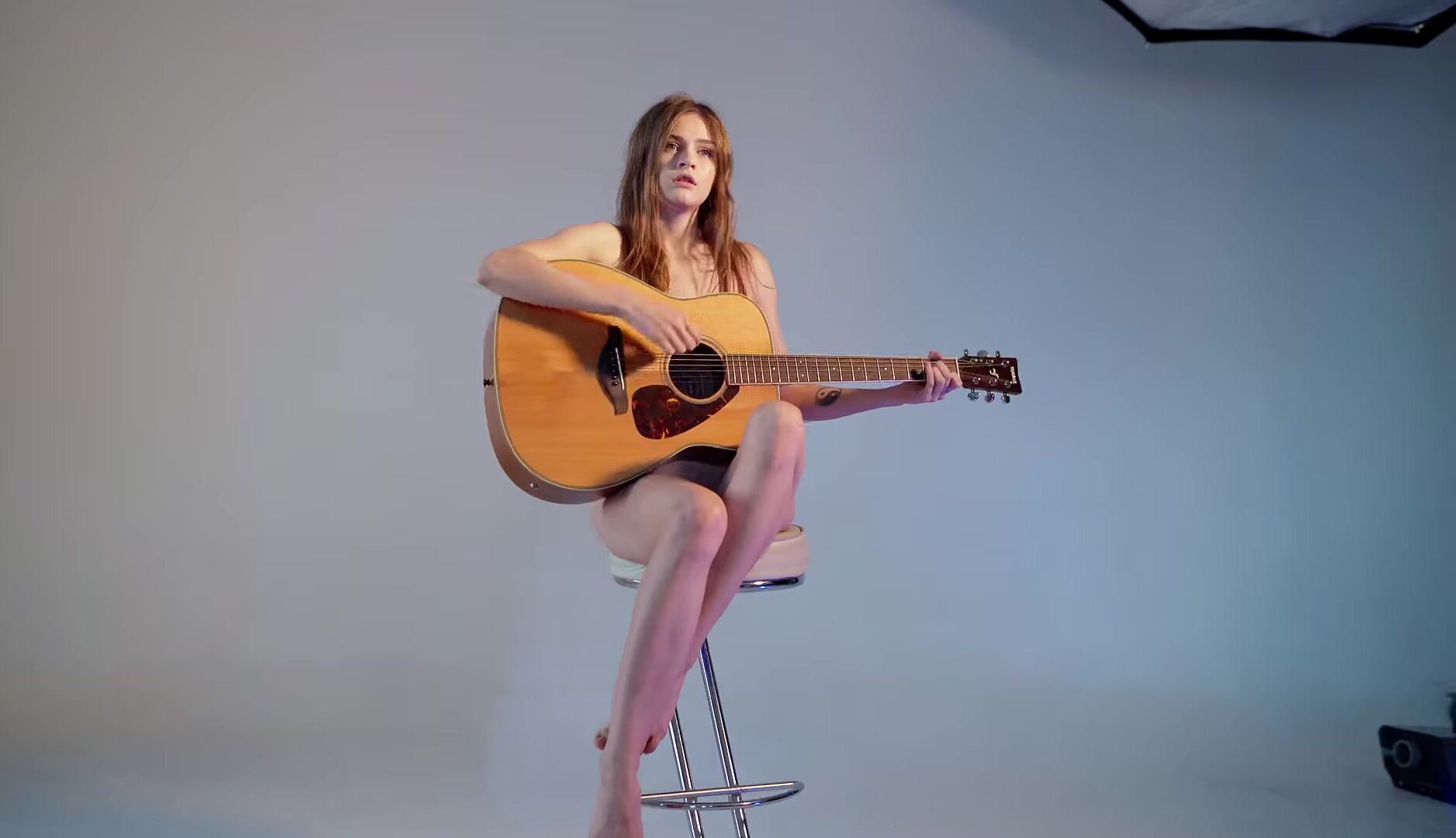 girl posing naked with a guitar (music)