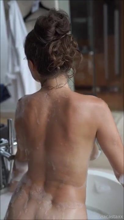 Olivia Casta nude in soapy bathtub